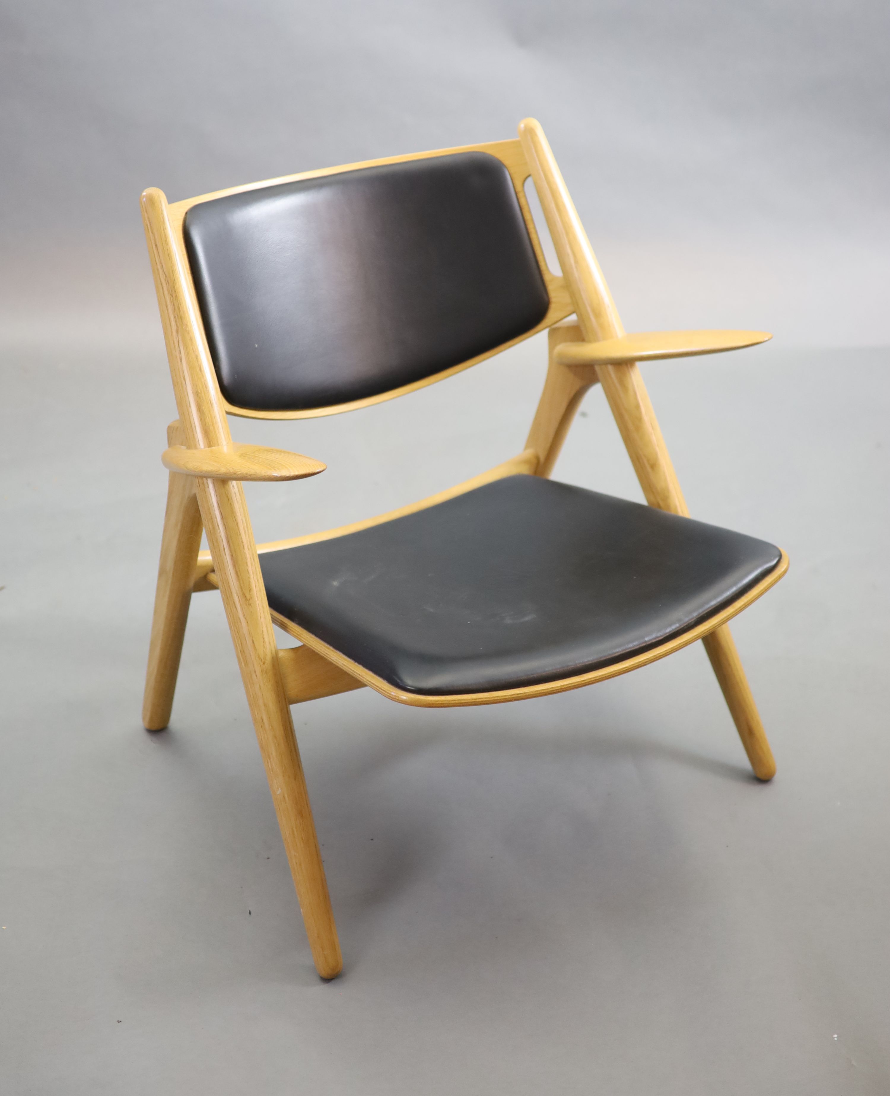 Hans Wegner for Carl Hansen, an oak and oak laminate framed ‘Sawback’ armchair, 73cm high, 52cm deep, 76cm high